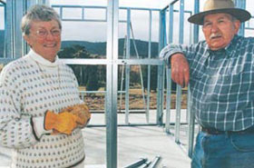 John and Fay among the steel wall frames during construction