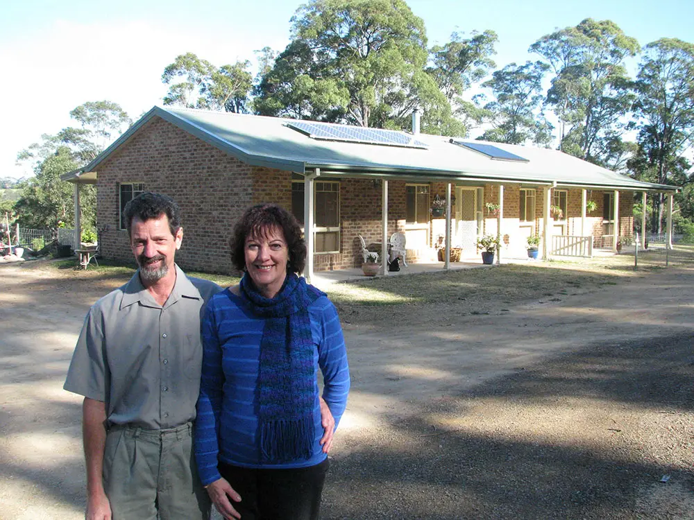 Wayne & Julie standing infront of completed kit home