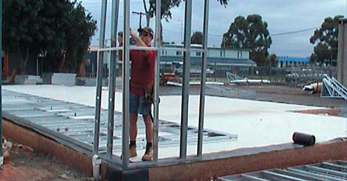 Home builder installing modular steel frame